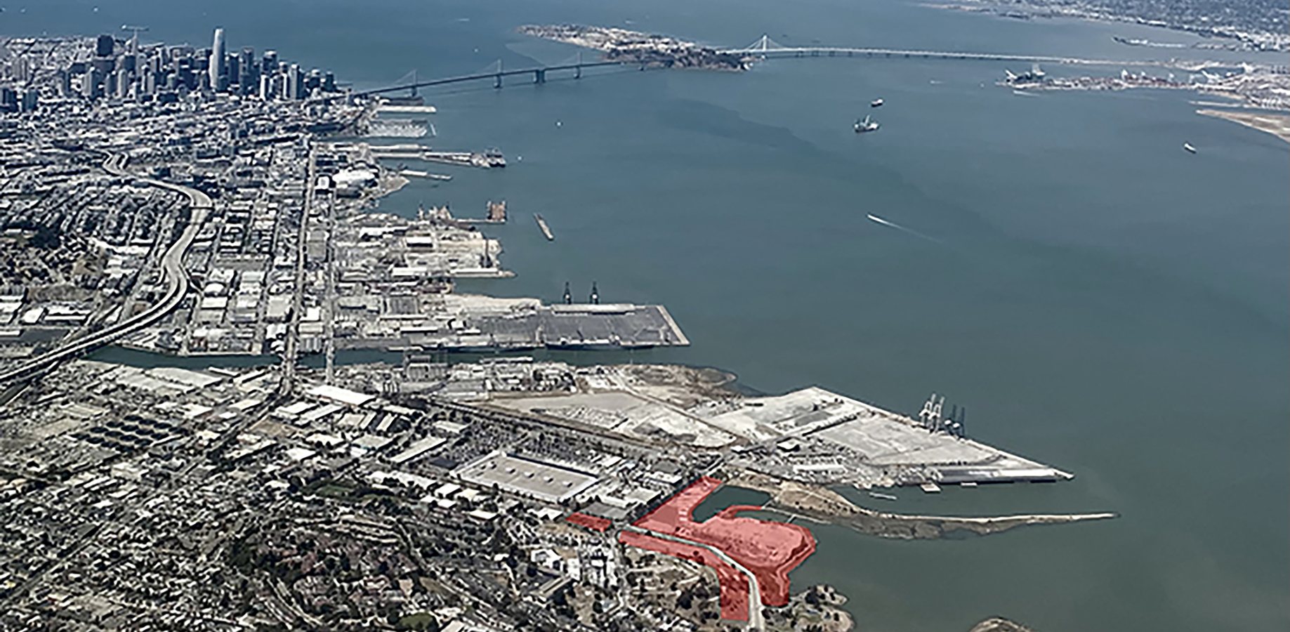 Aerial view of the San Francisco waterfront with the Hunters Point site highlighted in red
